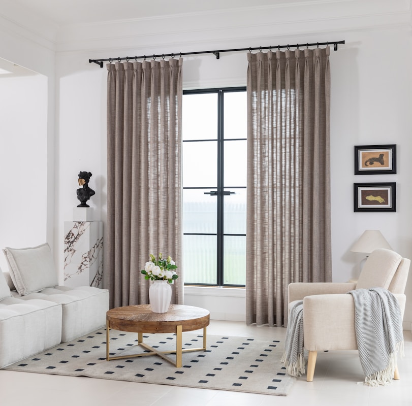 A cozy living room with light decor.