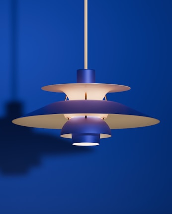 A modern blue pendant lamp illuminates the room.