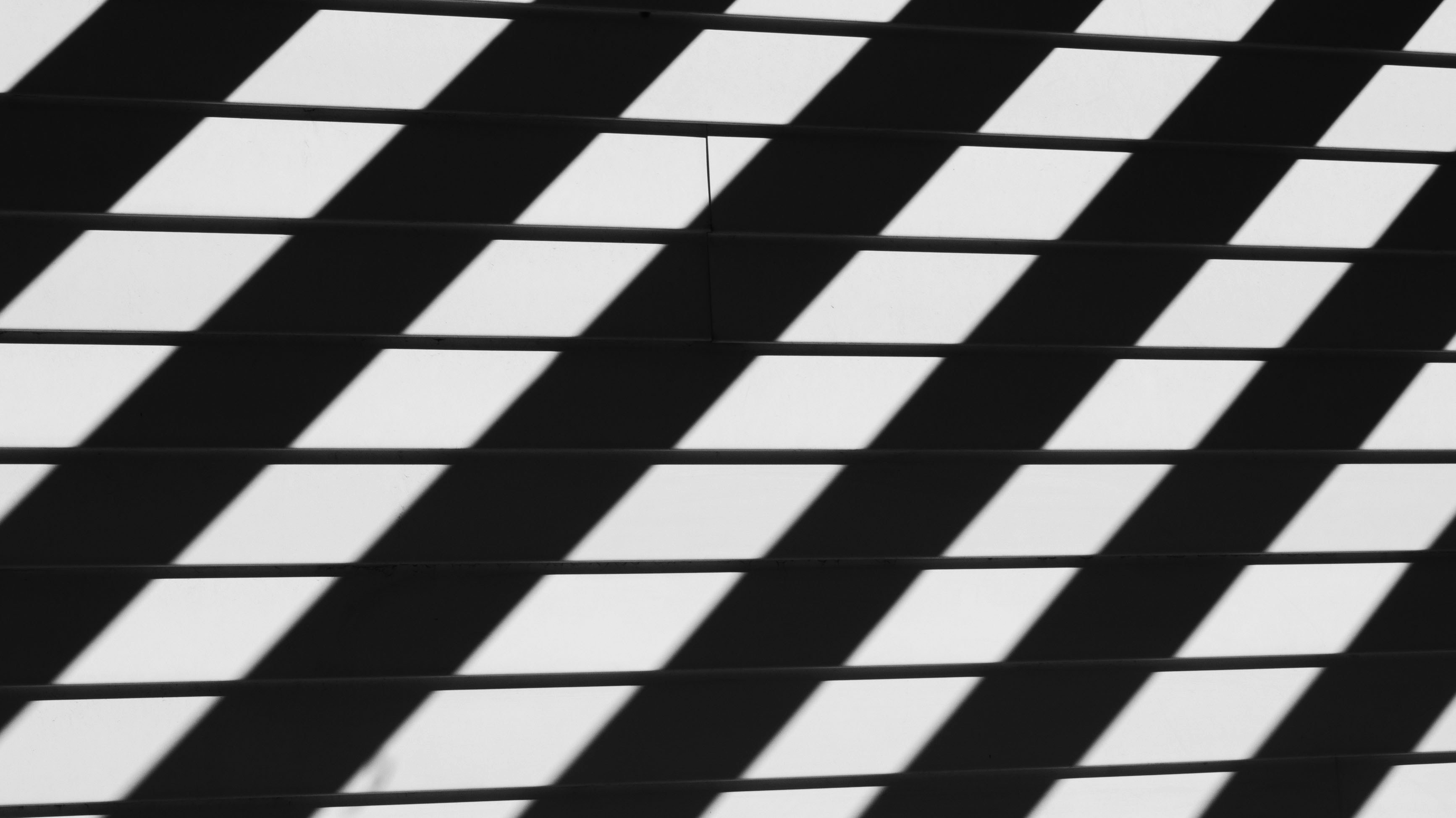 Bold diagonal shadow lines across a surface