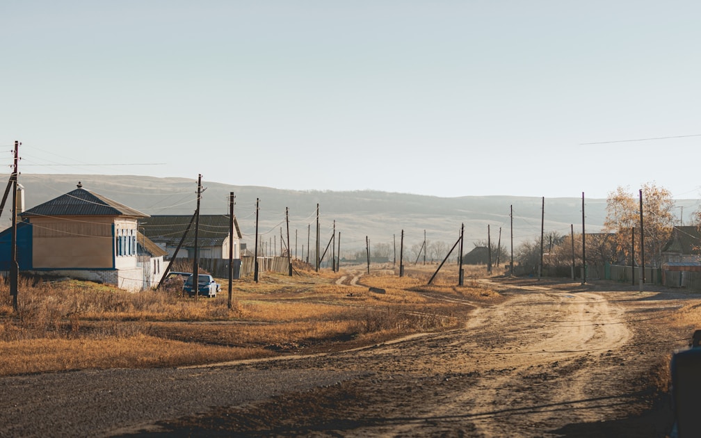 Hunter moving slowly through hardwood timber in November looking for deer sign