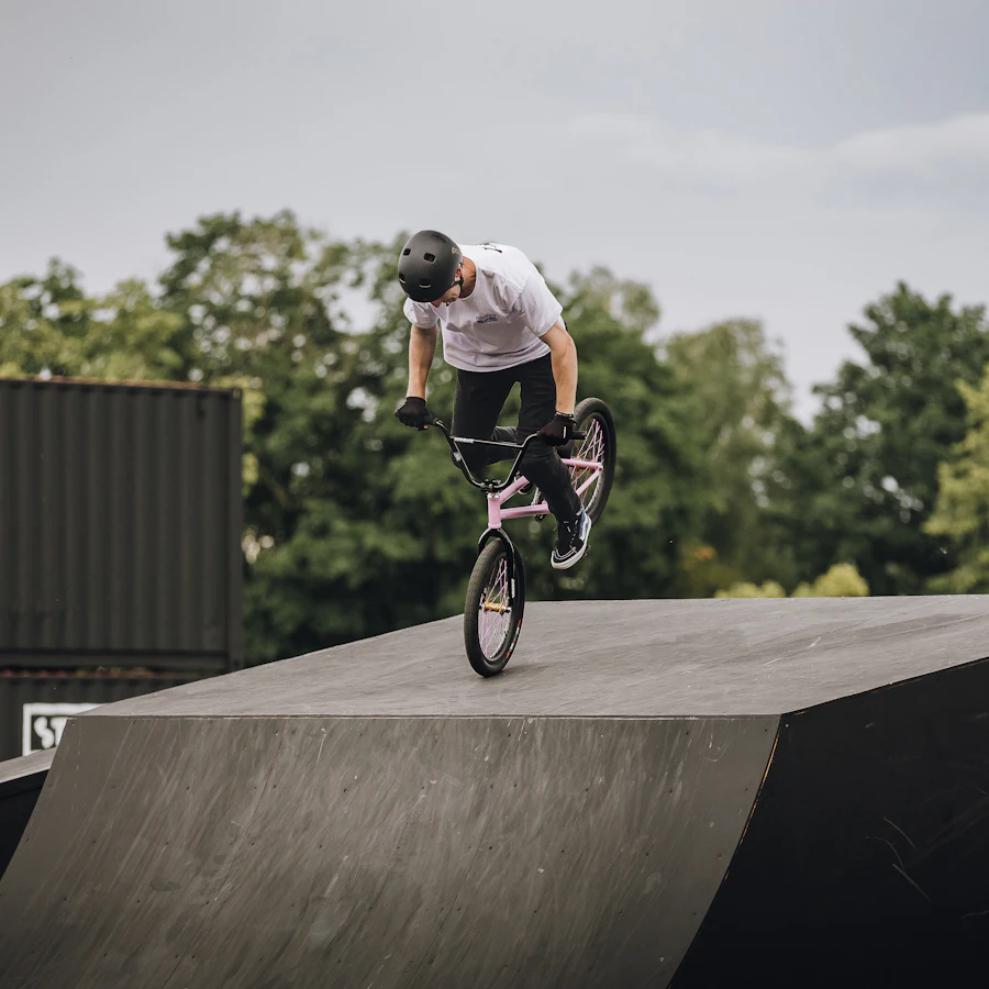 BMX rider performing trick on a ramp