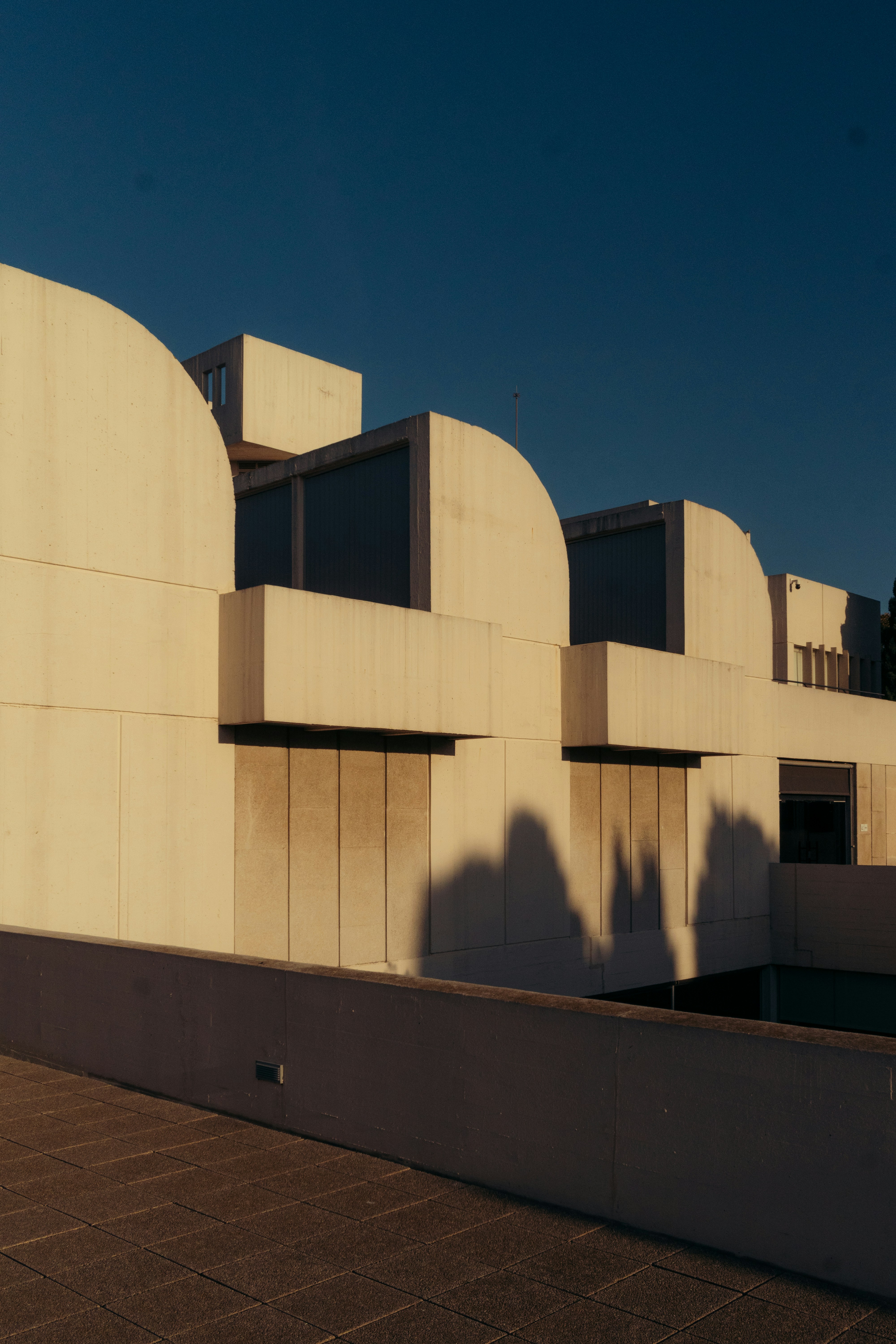 Modern building with rounded arches and shadows