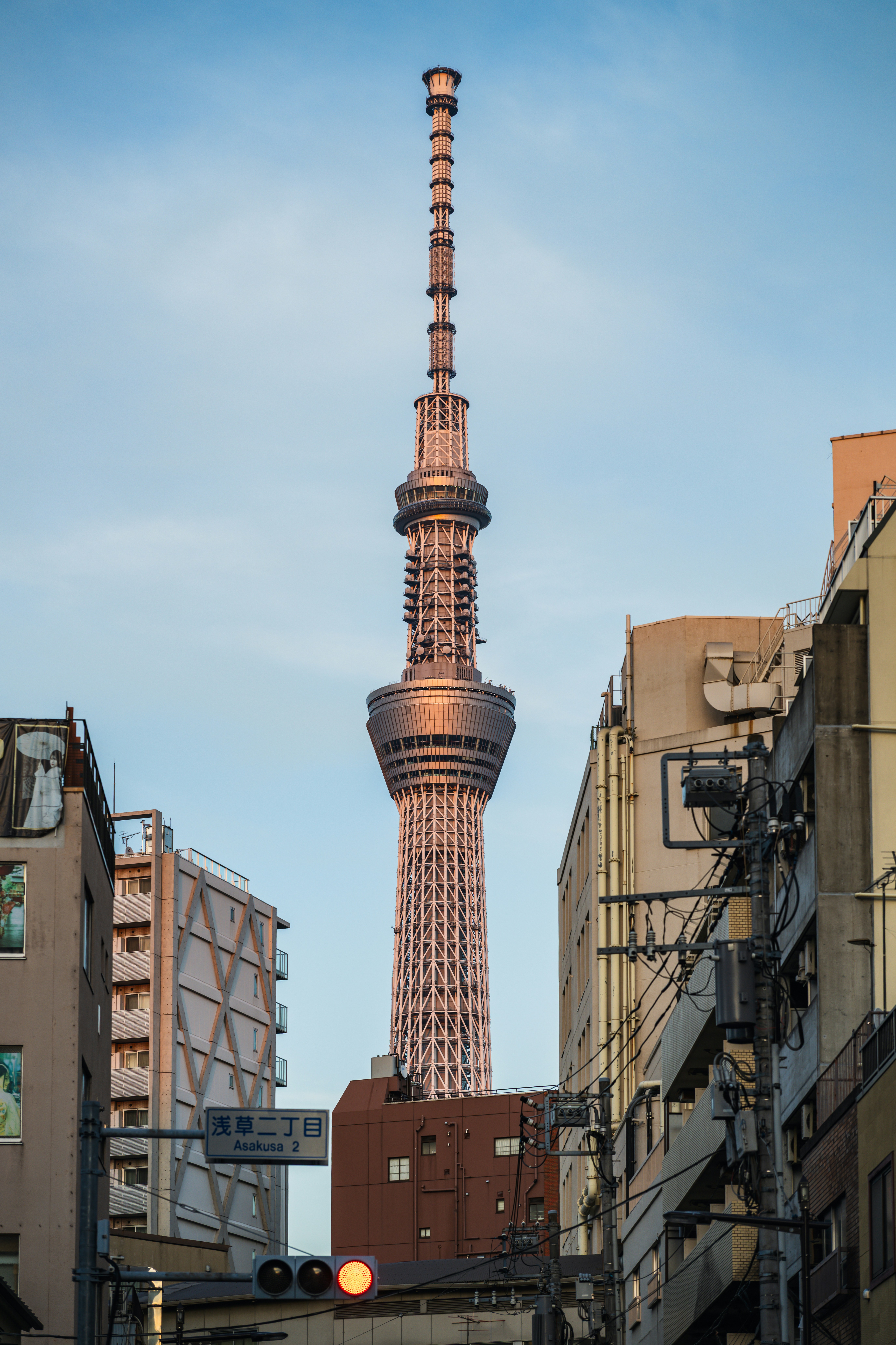 Tall skyscraper tower between city buildings