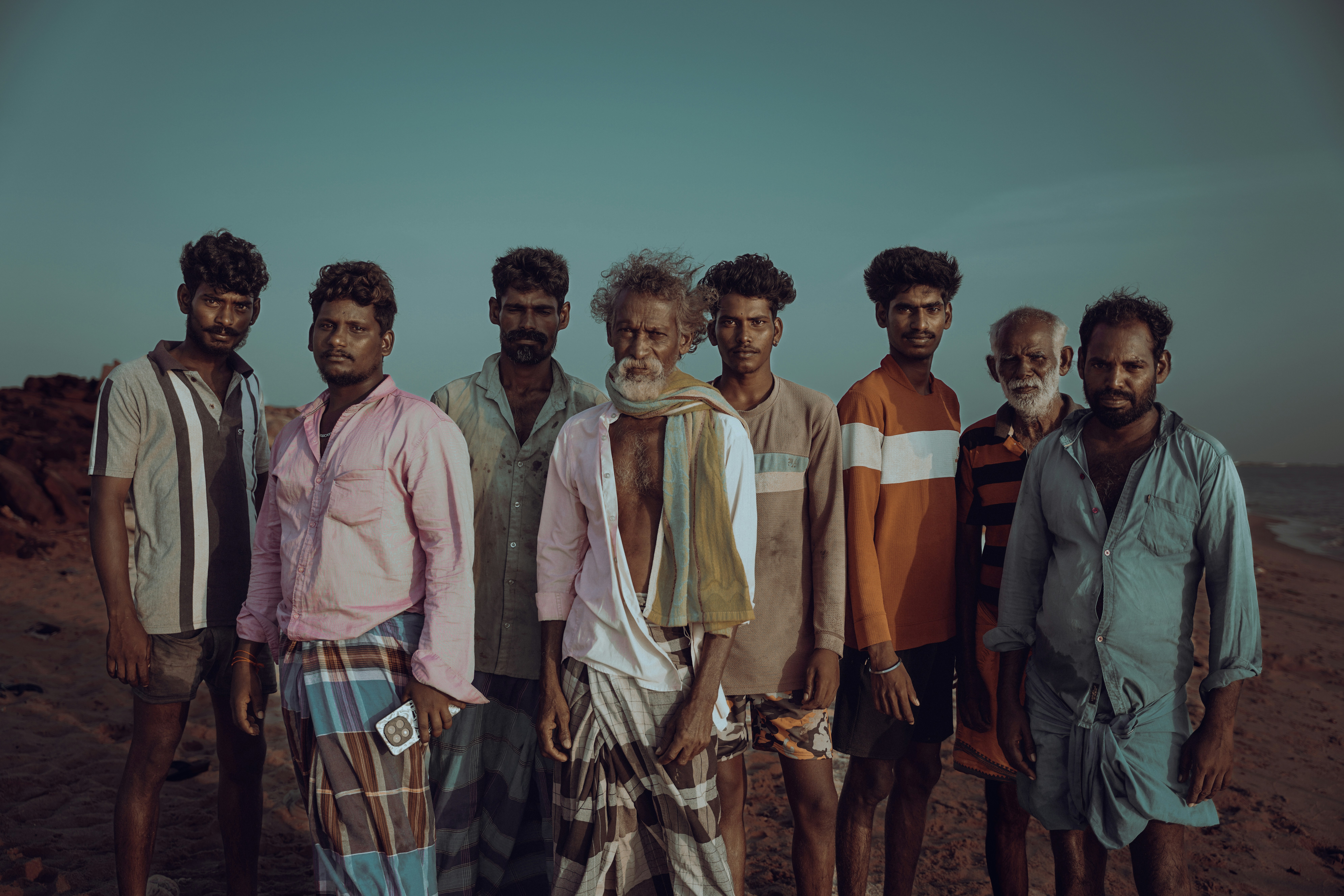 A group of men standing together outdoors