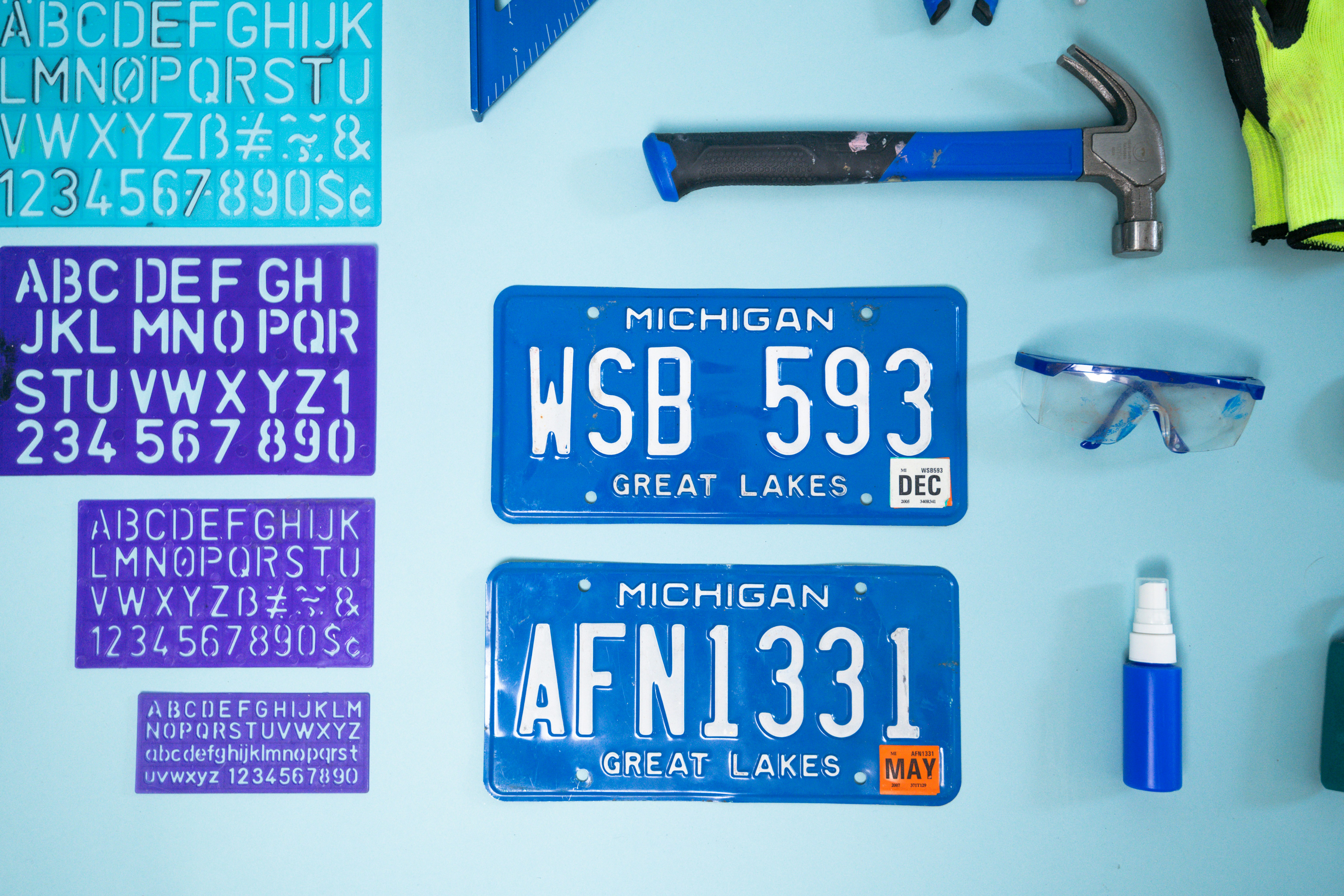 Michigan license plates and alphabet stencils on wall