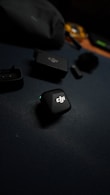 Dji wireless microphone system components on dark surface.