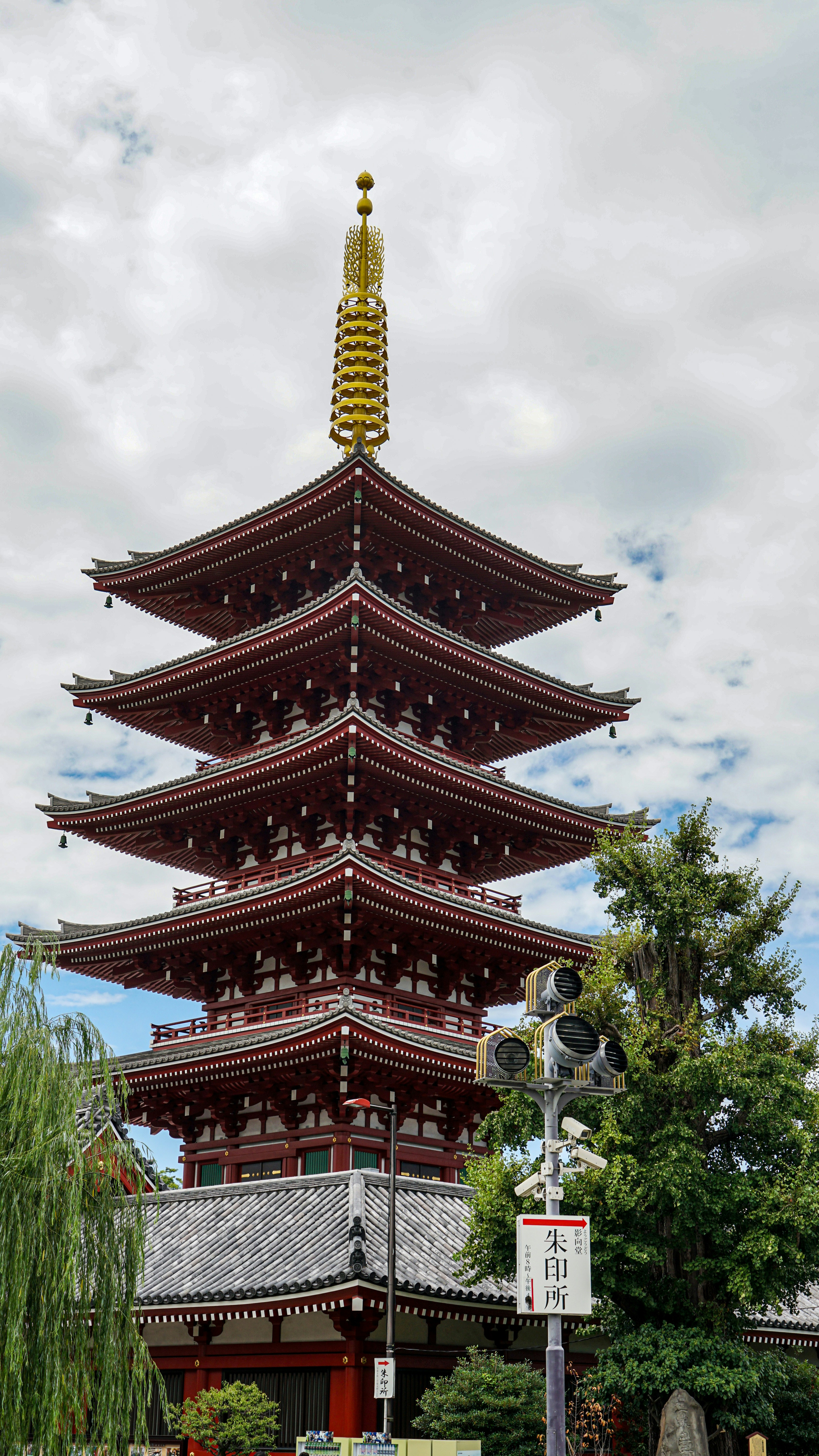 A tall, ornate pagoda with multiple tiers against sky.