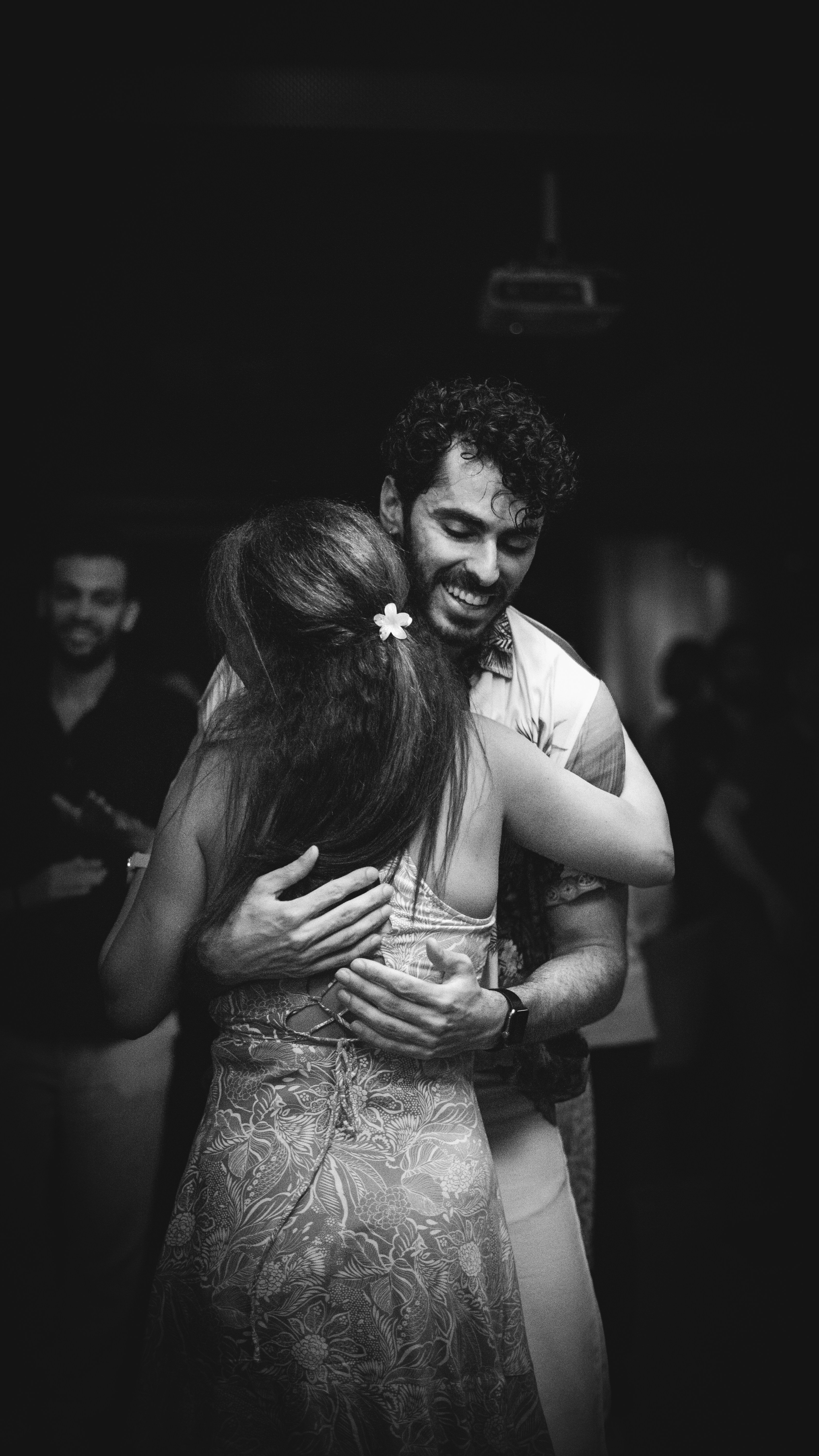 Couple embracing and dancing closely together