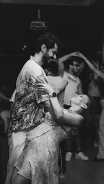 Couple dancing closely together at a party