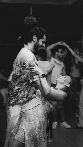 Couple dancing closely together at a party