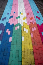Colorful transgender pride flag painted on pavement