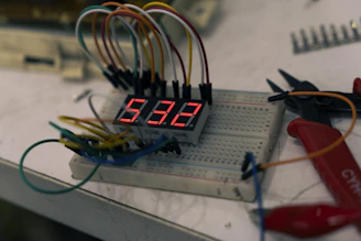 Digital clock display with wires and tools