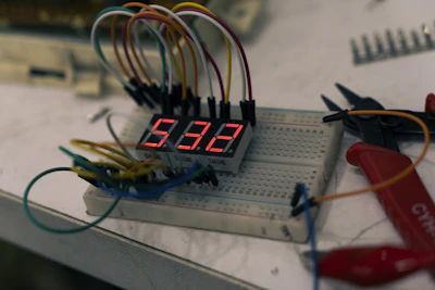 Digital clock display with wires and tools