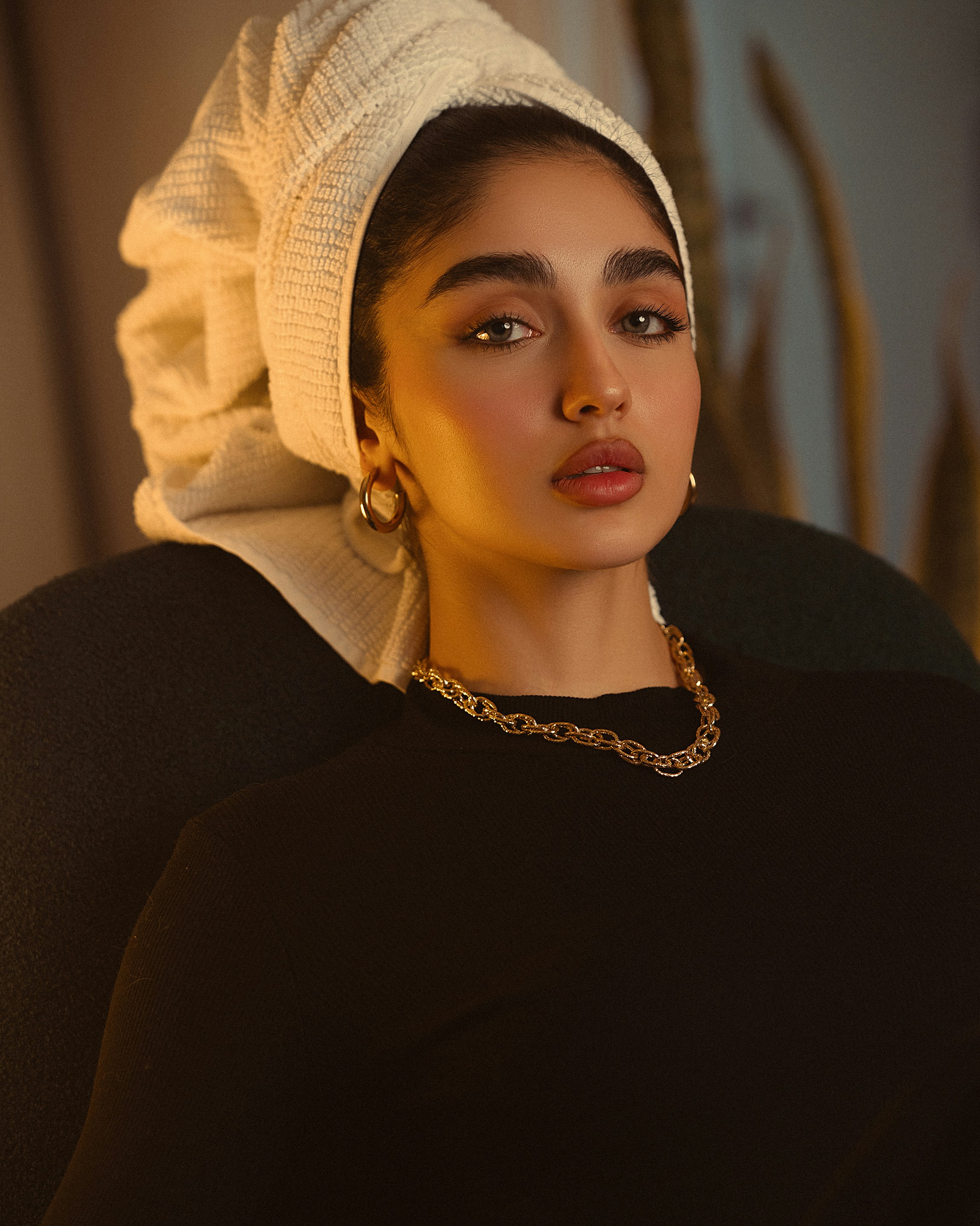 Young woman with headscarf and jewelry