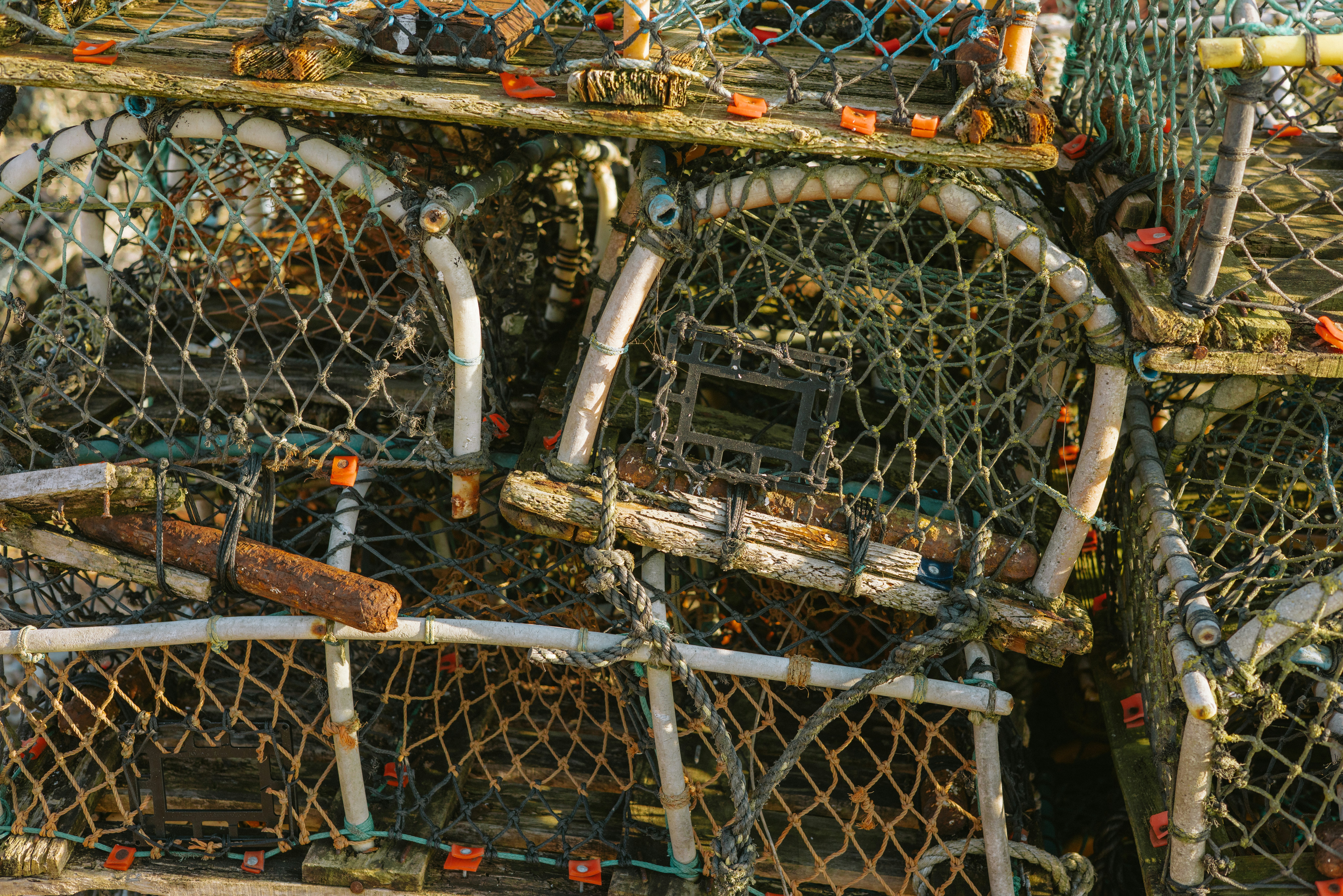 Pile of fishing traps stacked together outdoors