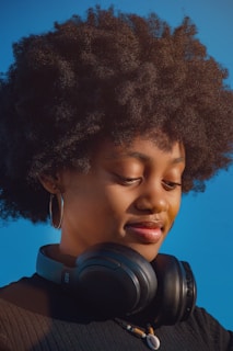 Young woman with headphones around her neck