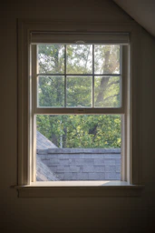 Sunlight streams through a window onto a rooftop