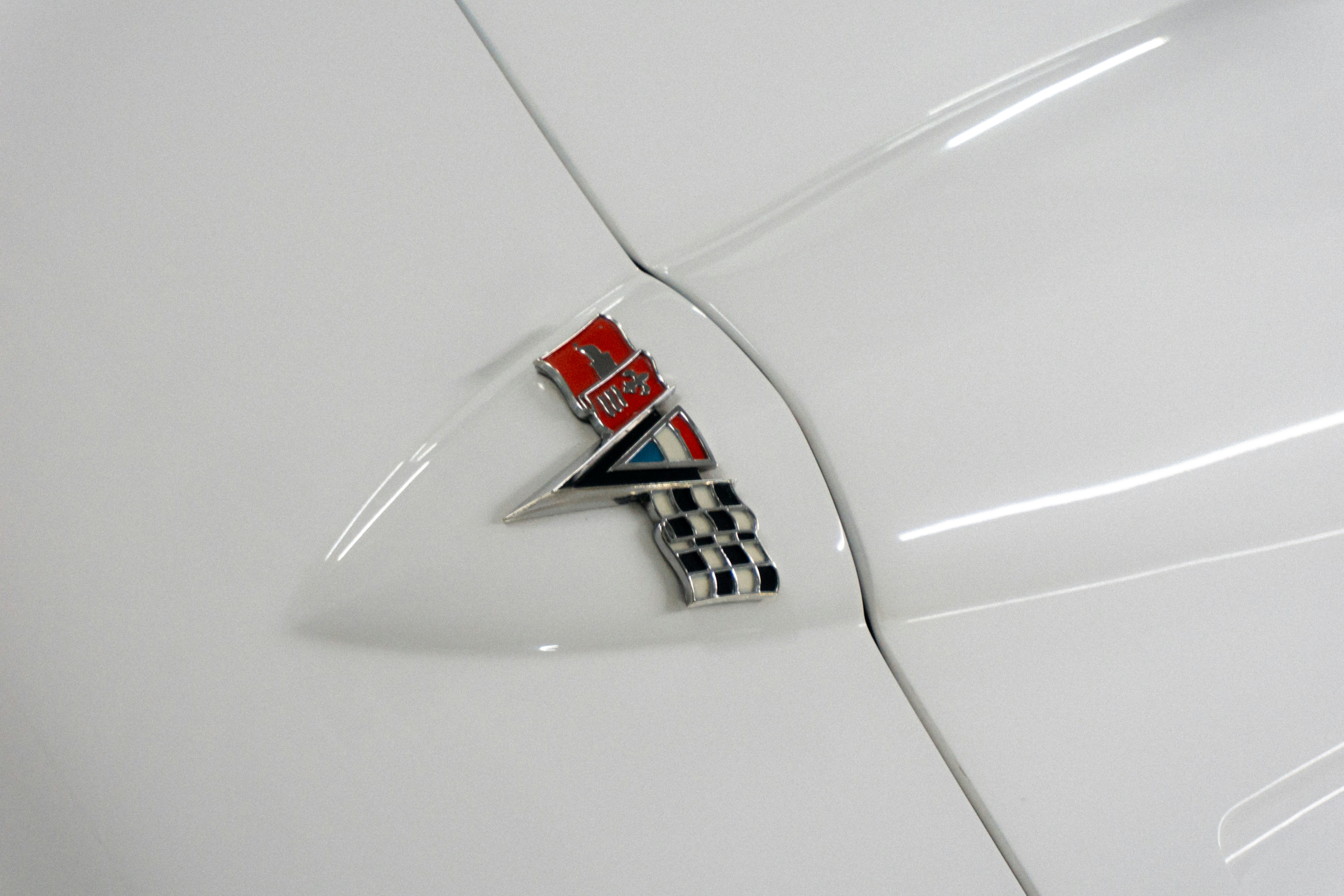 Corvette emblem on a white car