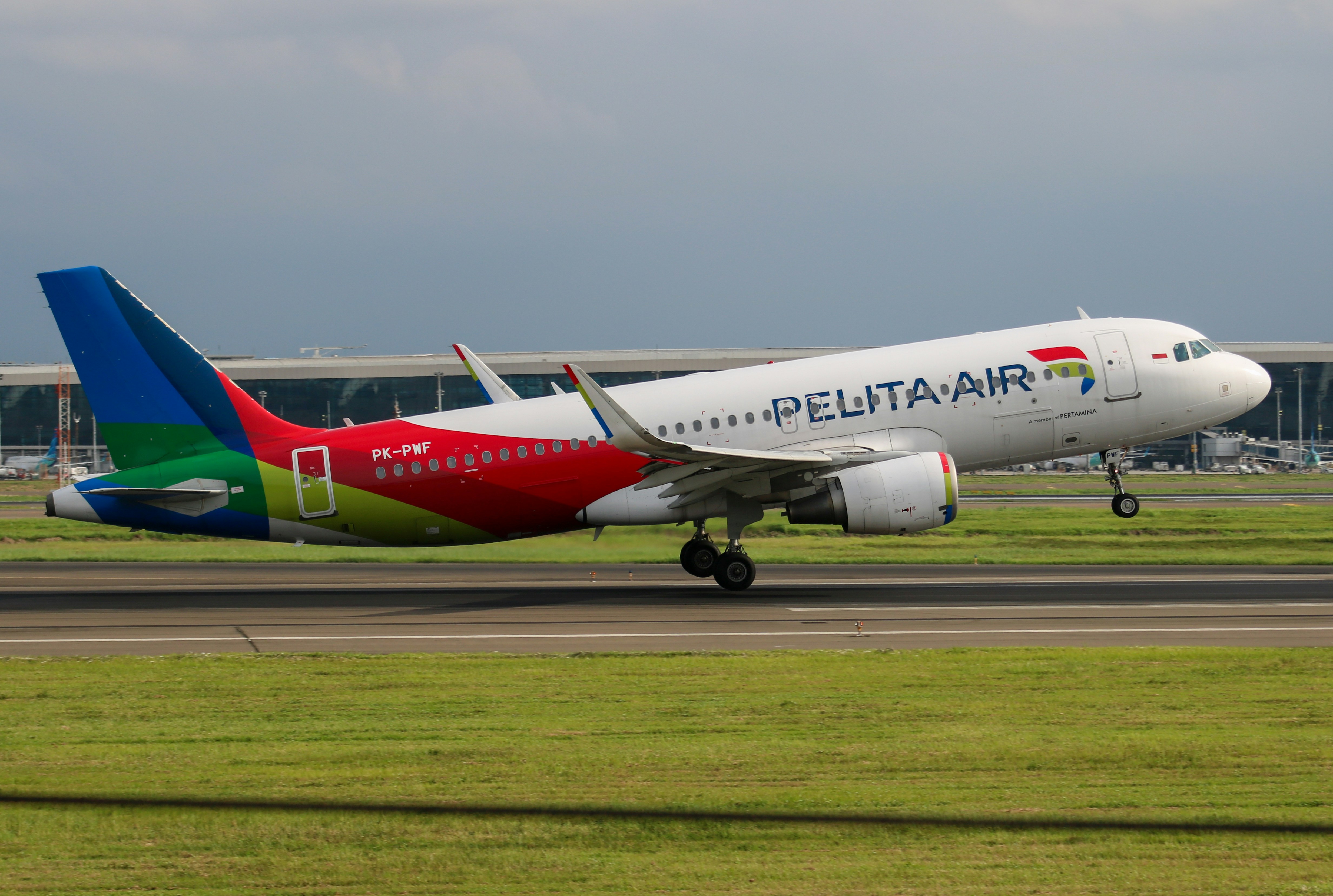 Pelita air airplane taking off on runway