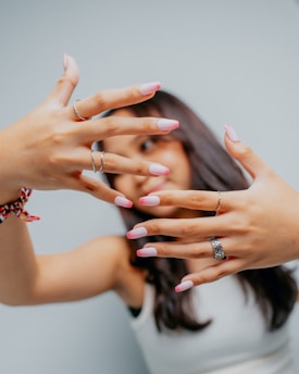 Woman with manicured nails and rings