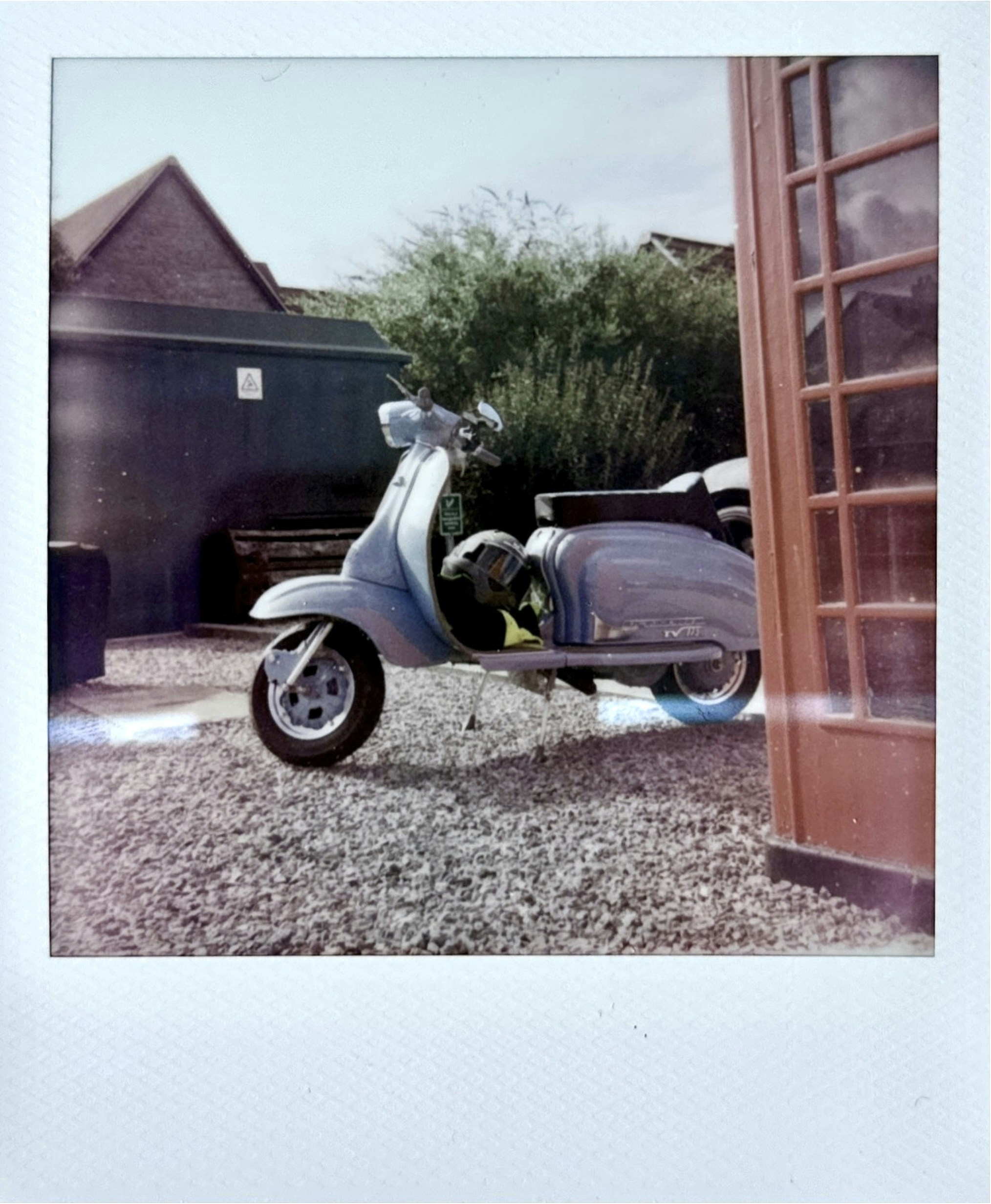 Vintage scooter parked outside a building