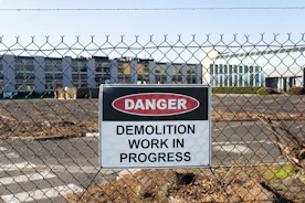 Danger sign for demolition work in progress.