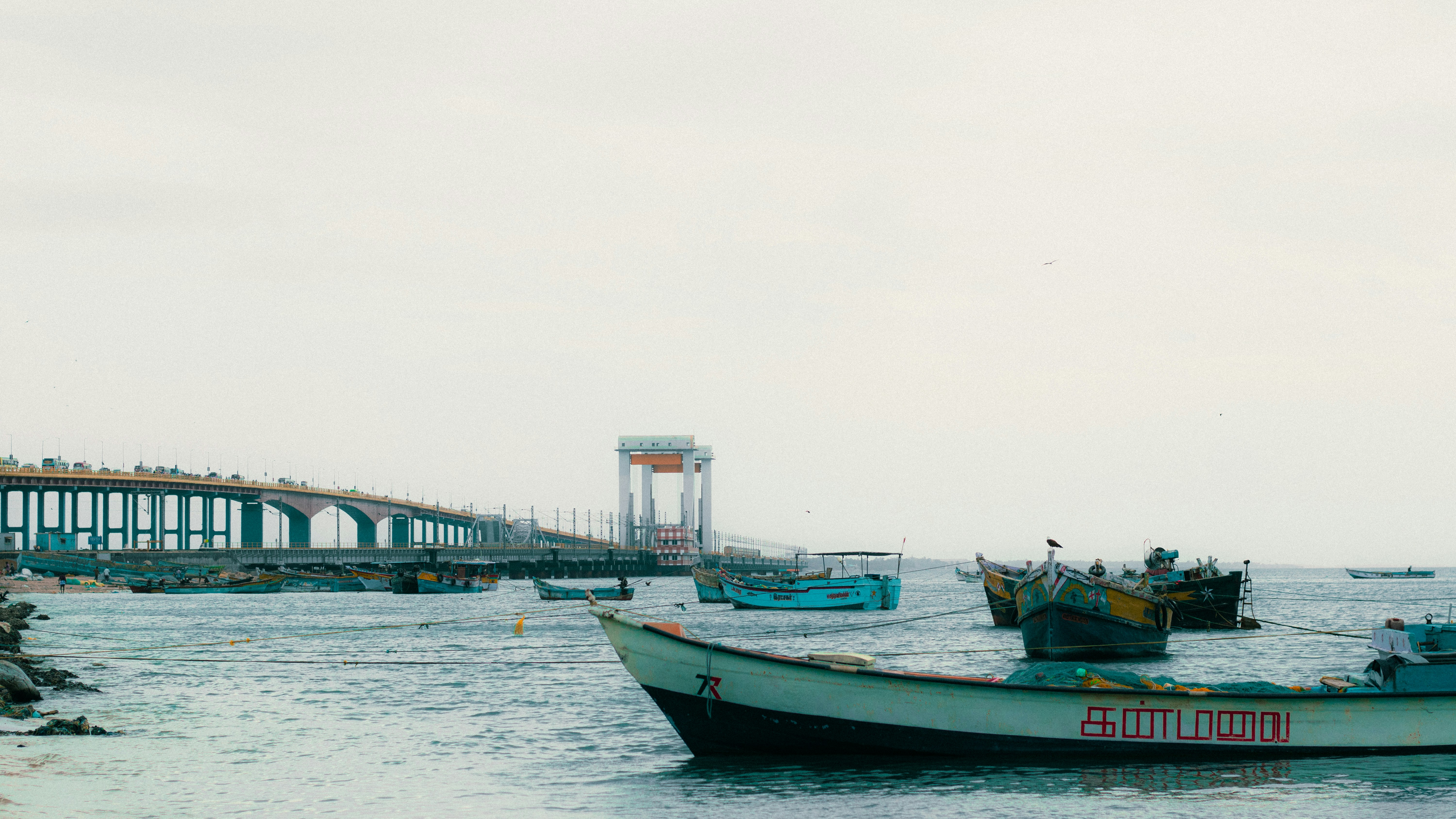 Boats float on the water near a bridge.Top 10 Địa Điểm Du Lịch Gần TP.HCM Dưới 150km