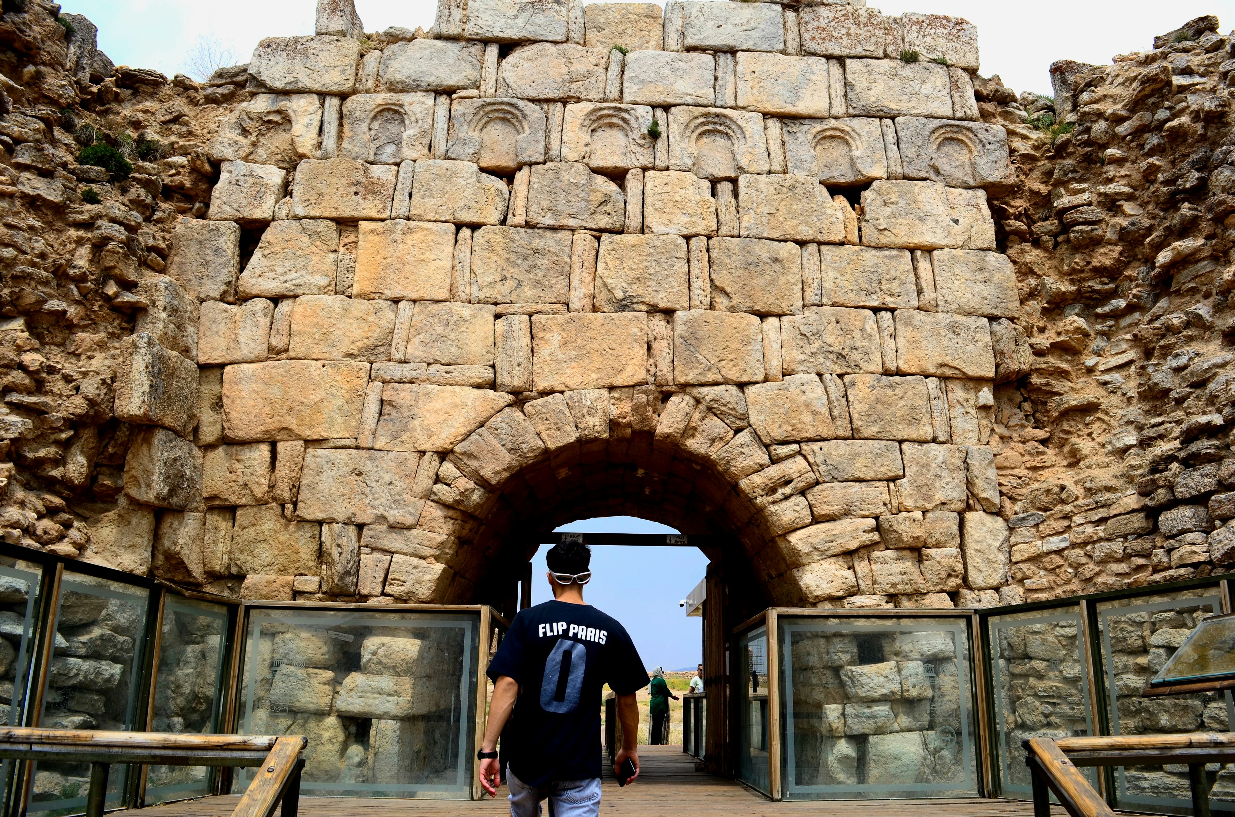 Ancient stone archway leading into ruins