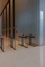 Modern lobby with glass partitions and tables