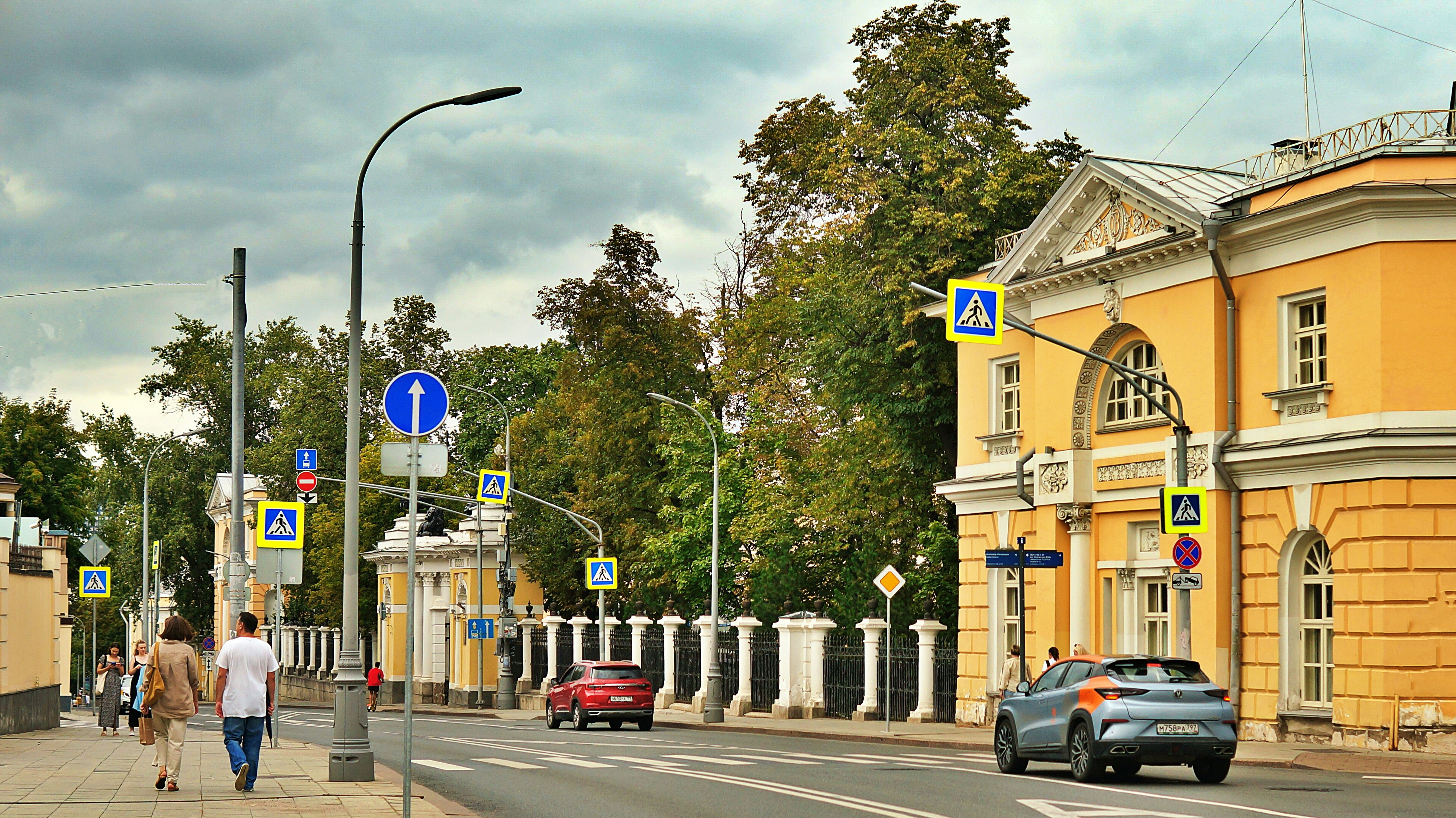 Yellow building and street scene with car