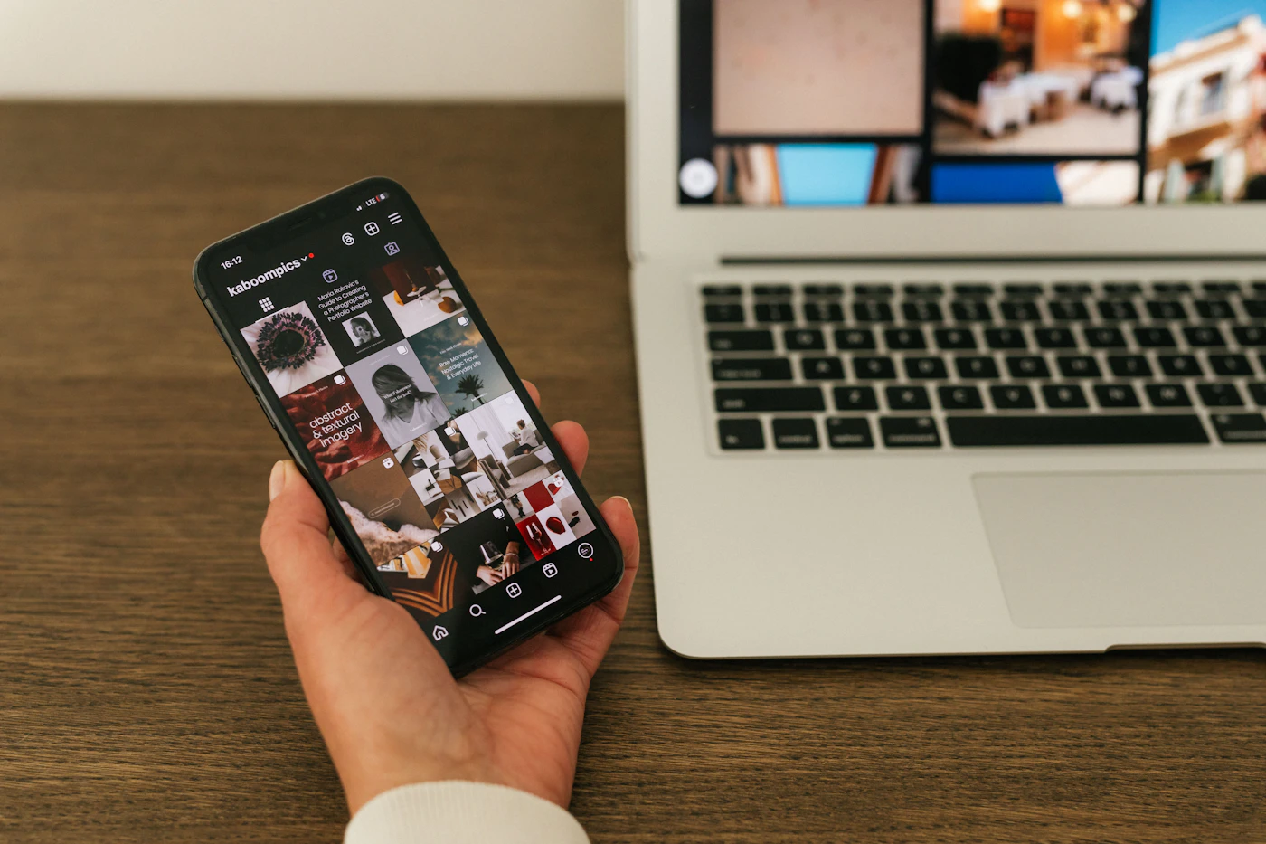 Phone beside a laptop on an office desk