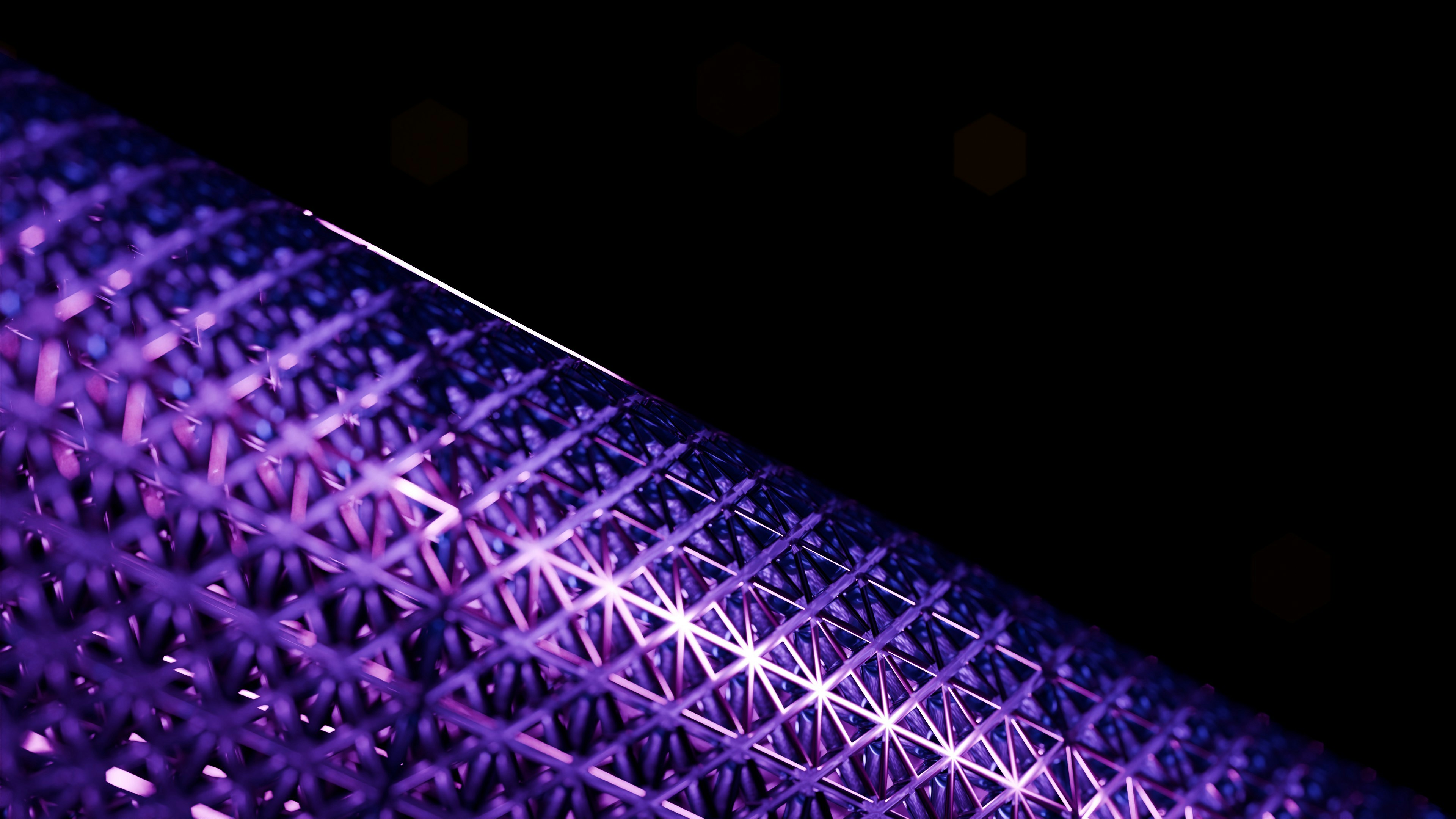 Close-up of a purple textured object against black