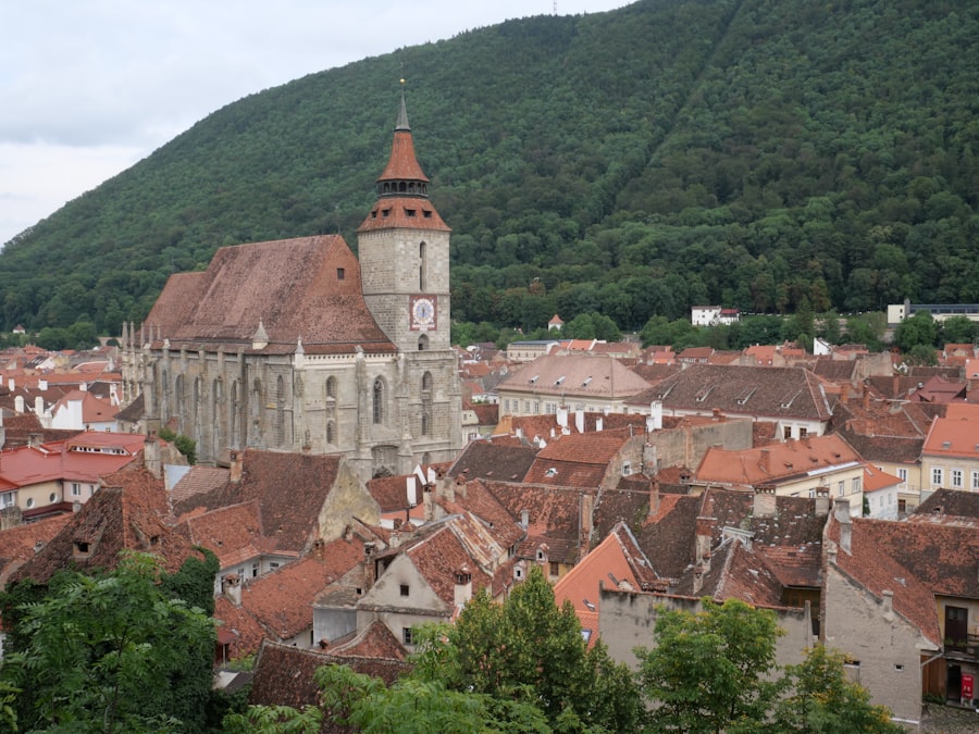 Brașov — medieval city centre with the Hollywood-style sign on Tâmpa Mountain