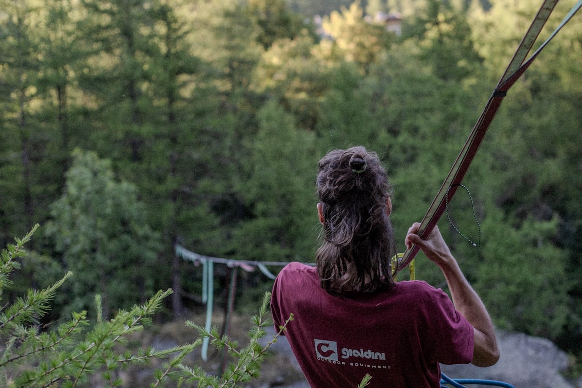 Slackliner performing a trick on the line