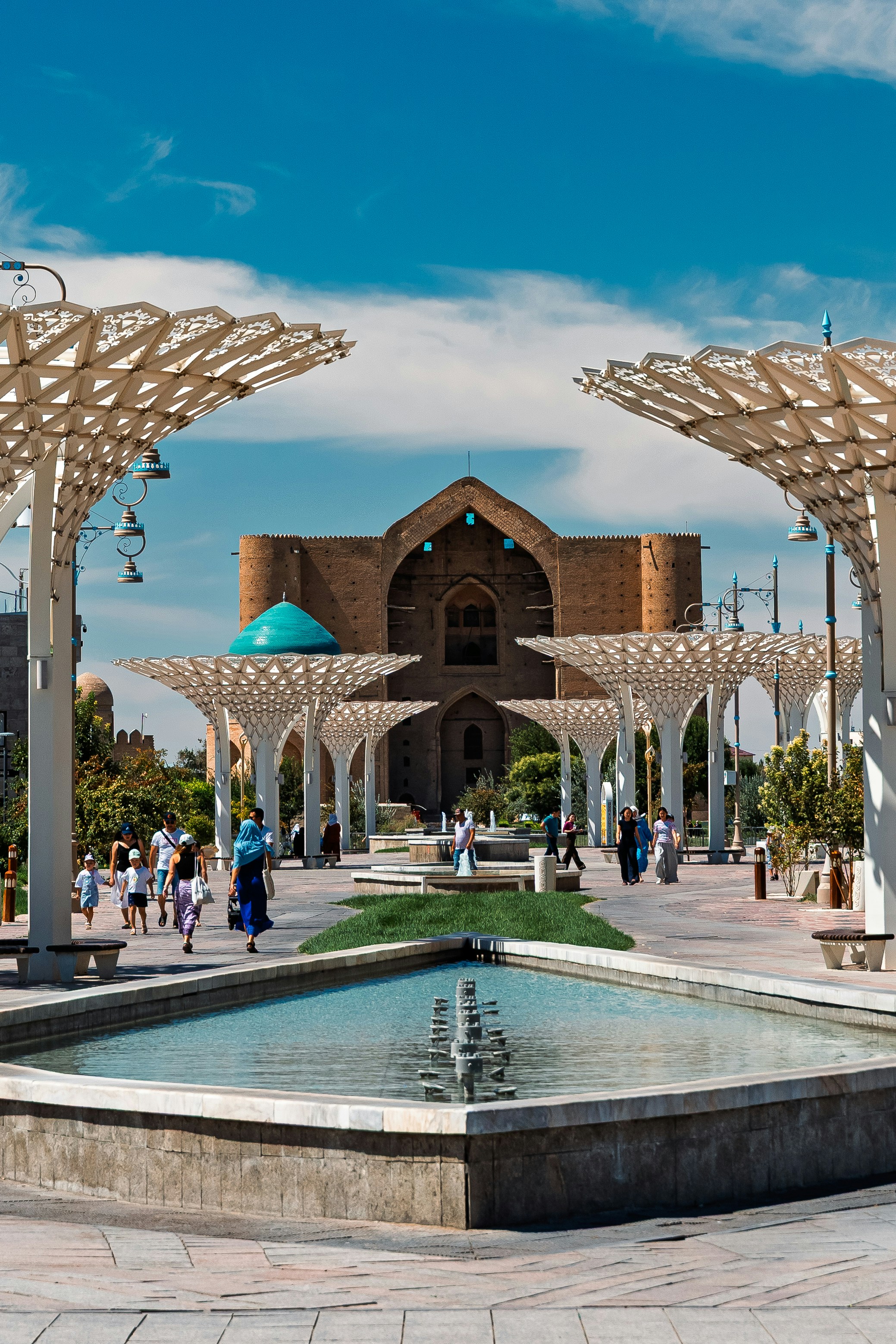 Modern plaza with unique canopy structures and fountain