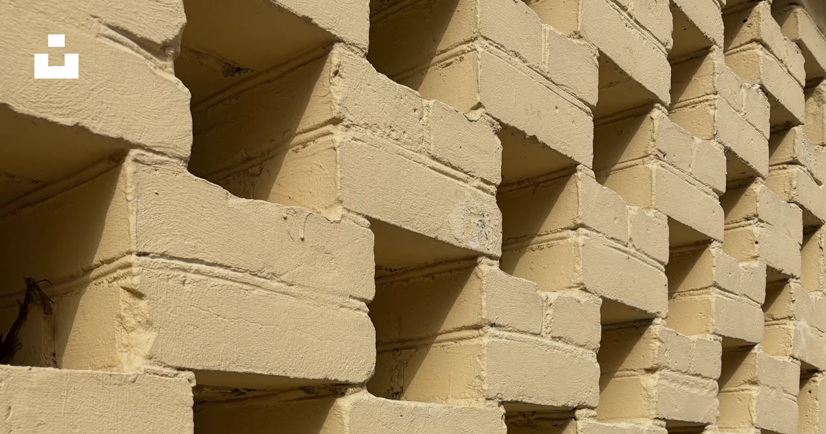 Layered Bricks Pattern Stacked light yellow bricks forming a pattern photo – Free Building ...