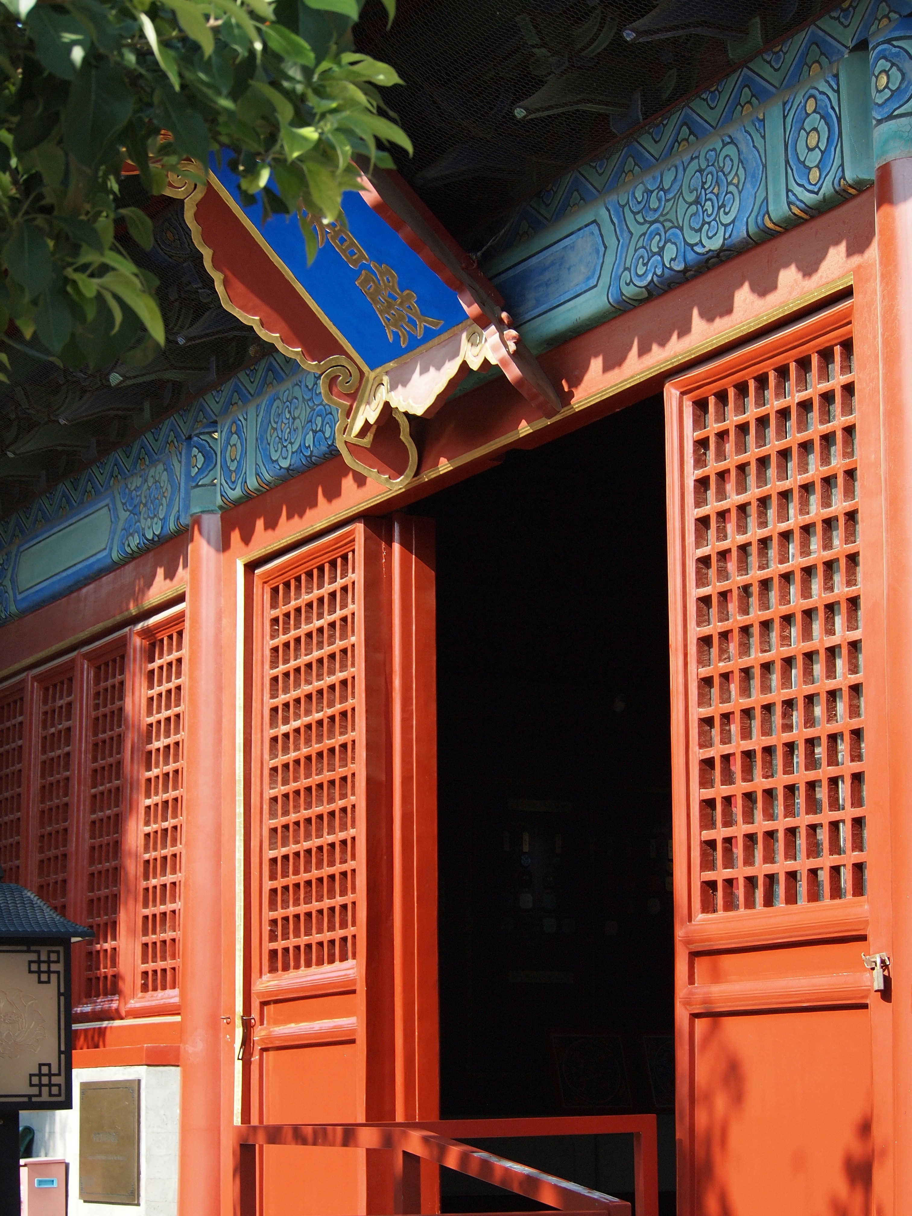 Traditional red building with ornate windows and doors