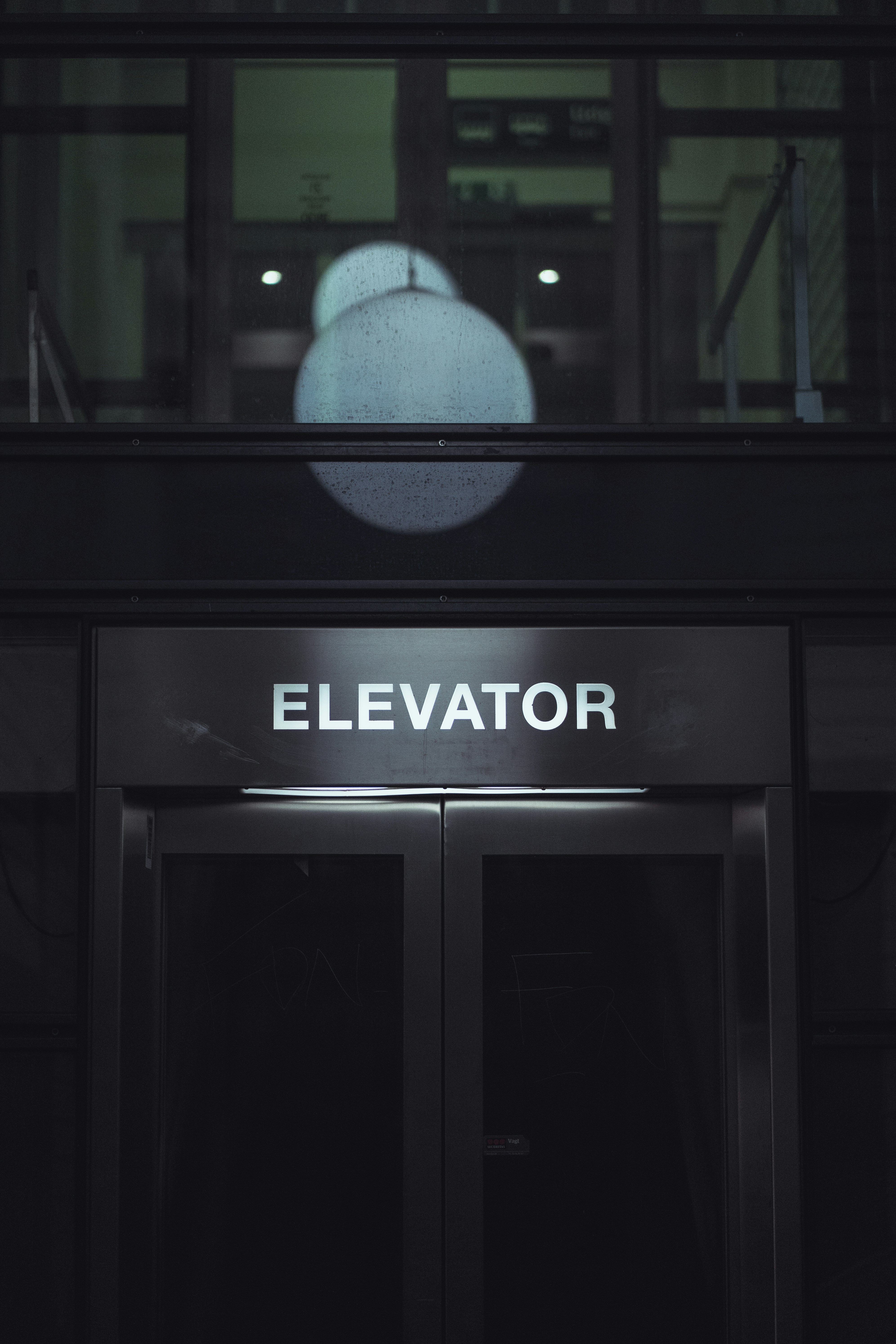 Elevator entrance with glowing lights above
