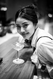 Young woman with a drink at a bar