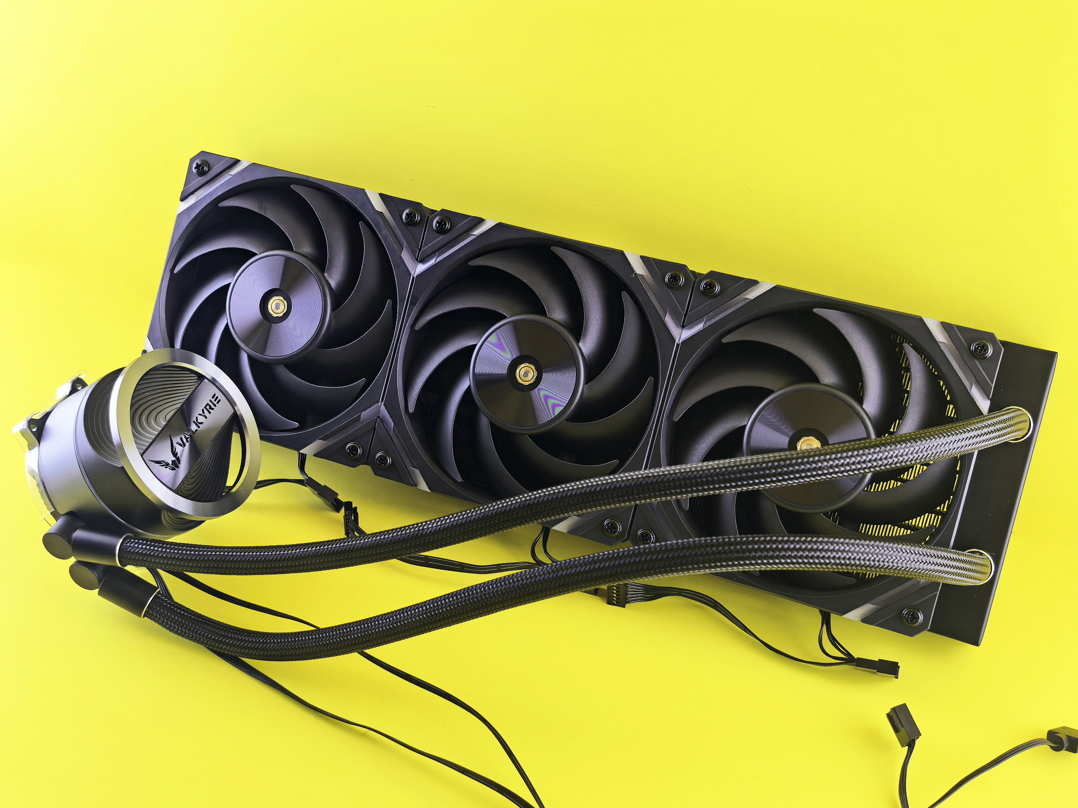 Computer liquid cooling system on yellow background