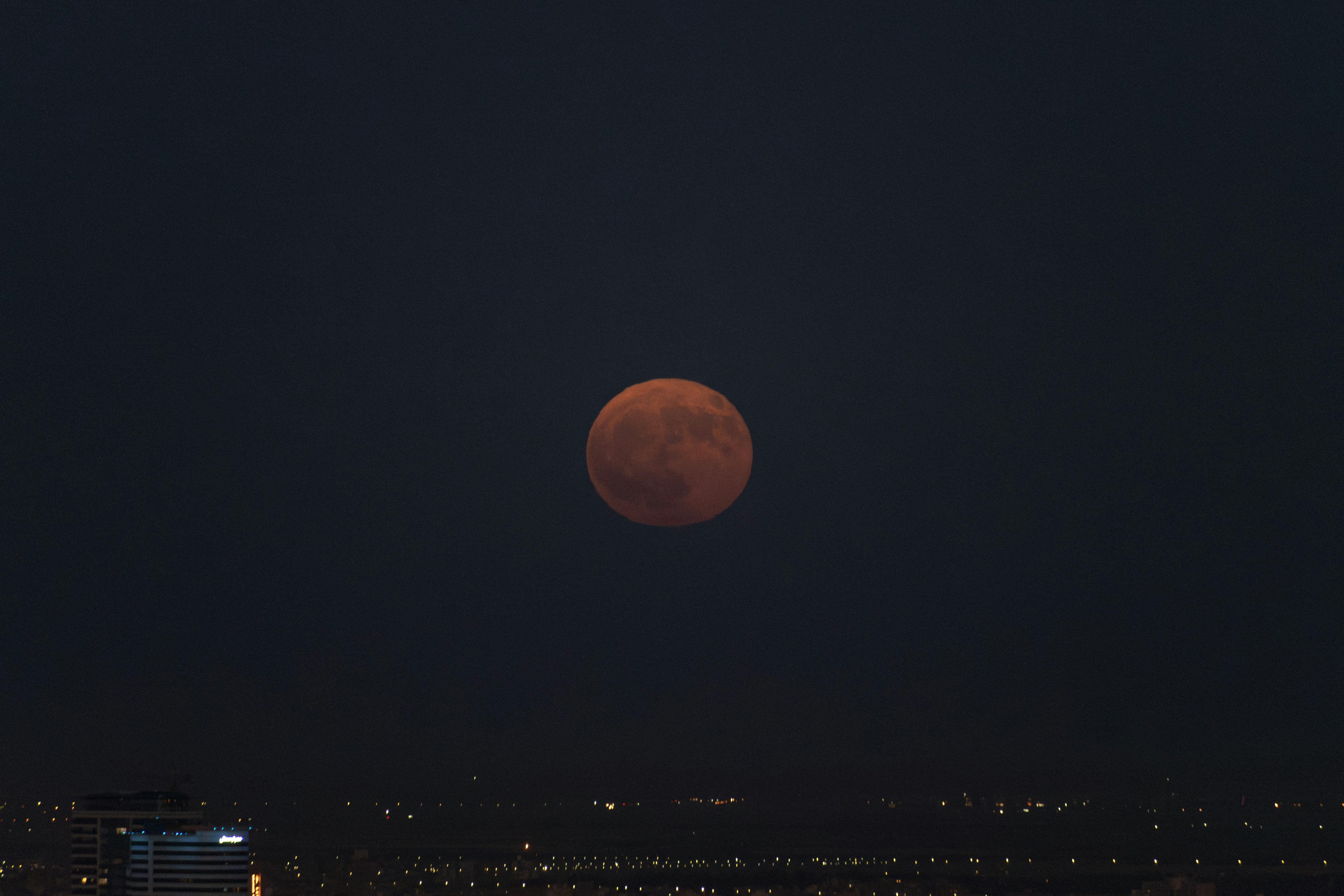 Red moon in the dark night sky