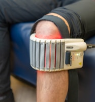 Therapy device on a person's knee