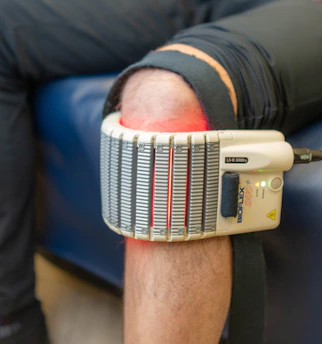 Therapy device on a person's knee