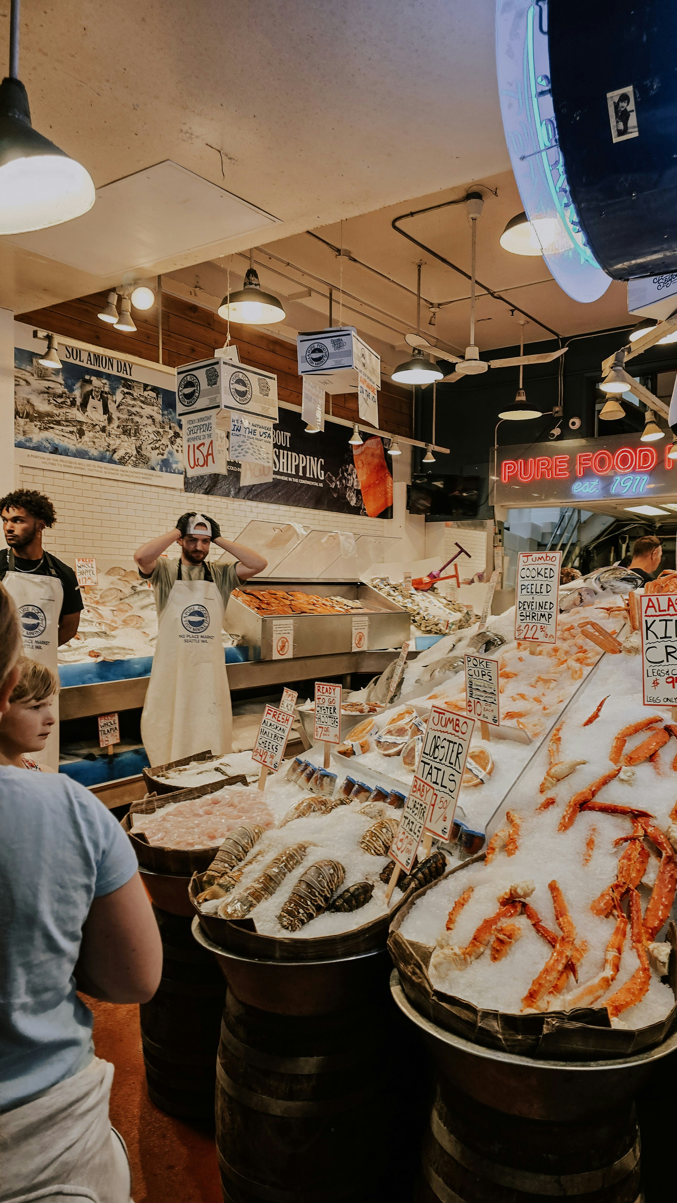 Fresh seafood displayed on ice at a market.