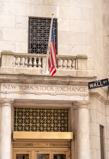 New york stock exchange building with american flag