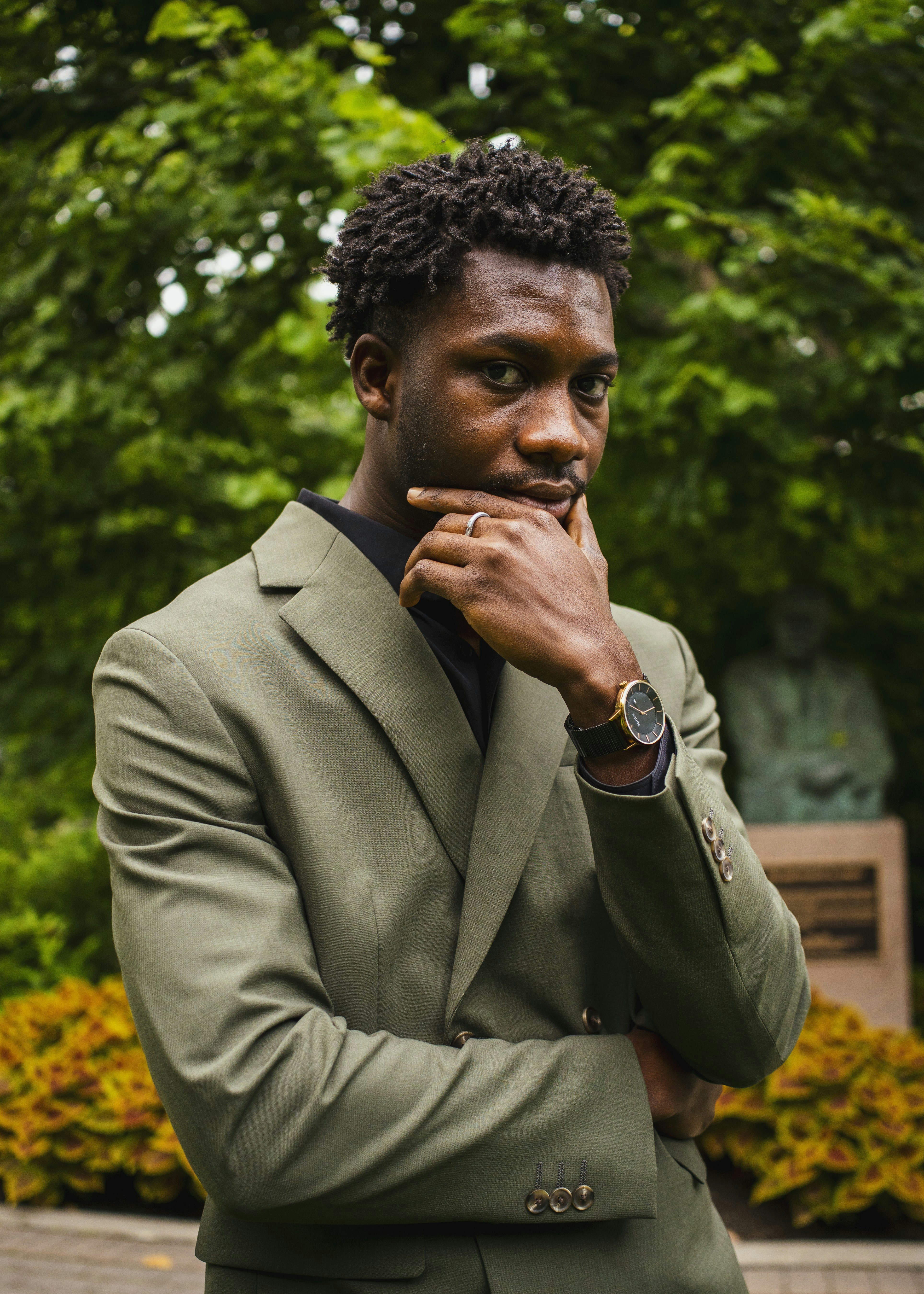 Man in suit looking thoughtfully into the distance