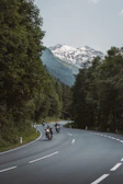 Motorcyclists riding on a scenic mountain road