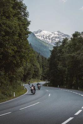 Motorcyclists riding on a scenic mountain road