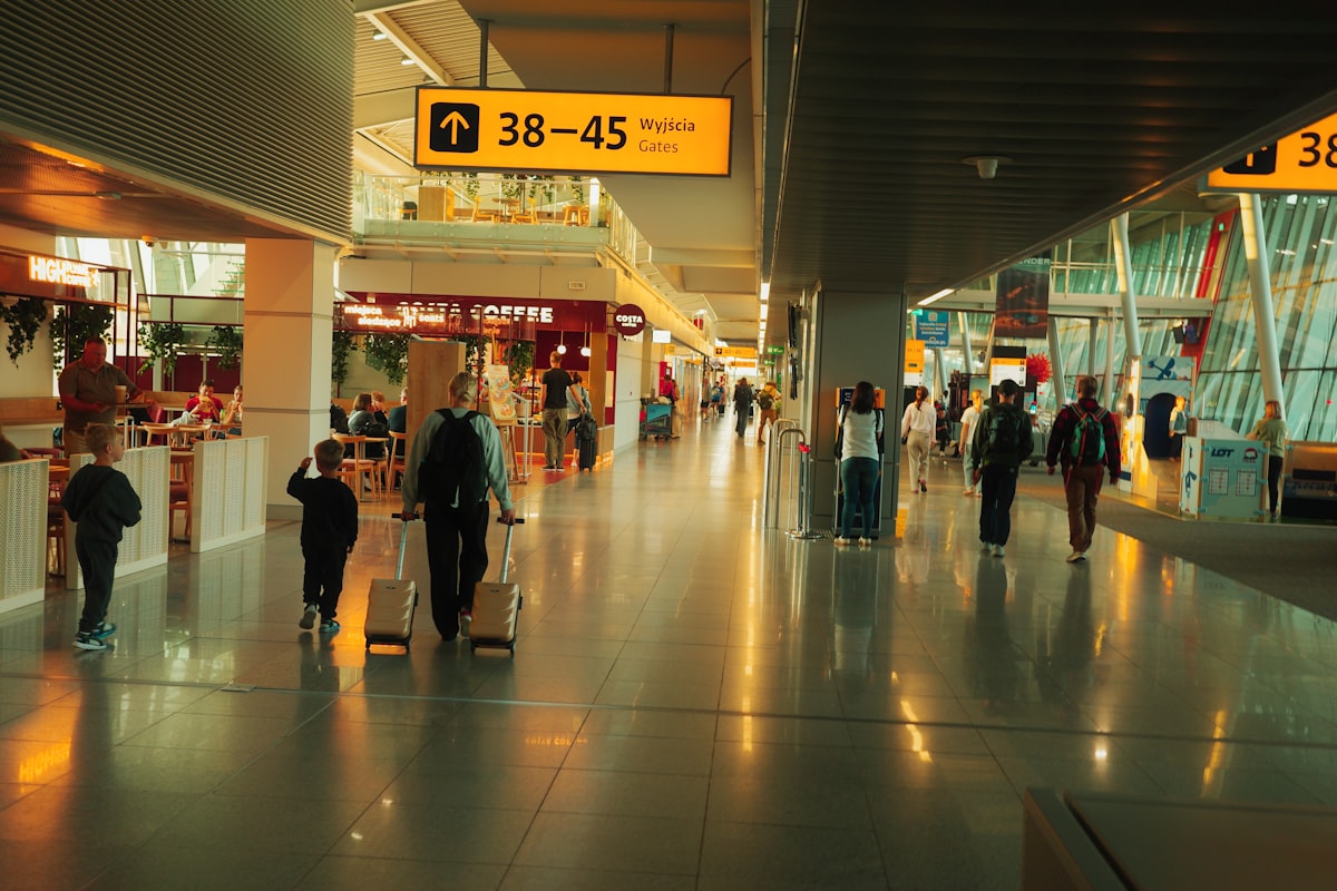 People walking through a modern airport terminal