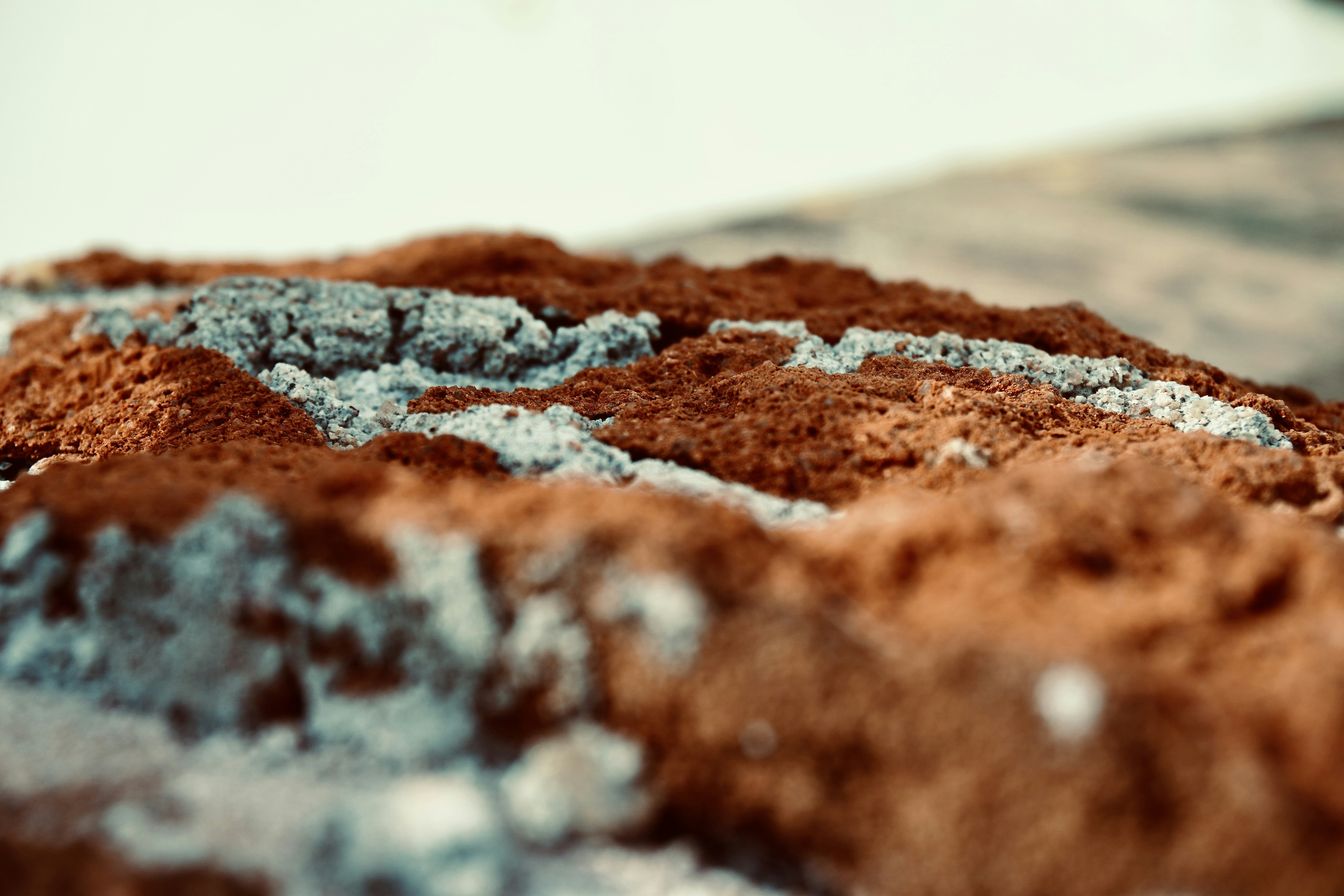Close-up of rough textured ground with scattered pebbles